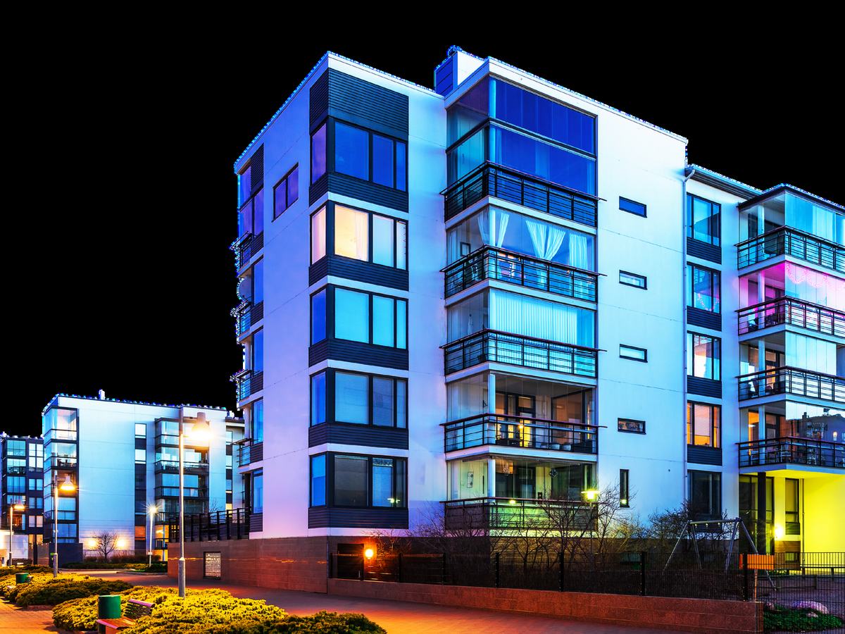 Illuminated apartment building at night